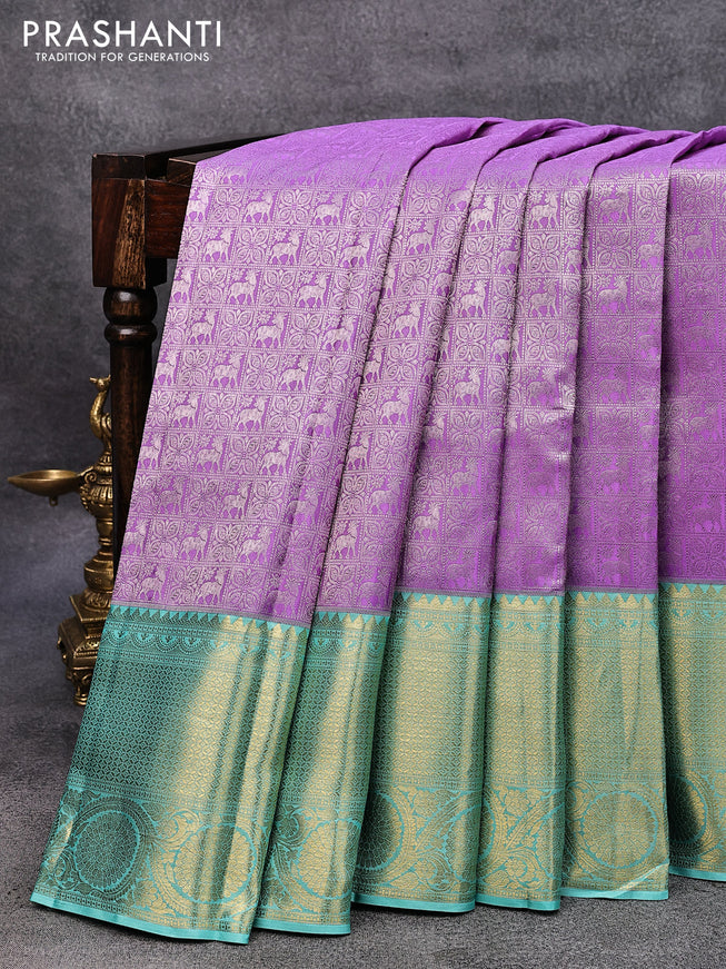 Pure kanjivaram silk saree lavender and teal blue with allover silver zari woven brocade weaves and long rich zari woven border