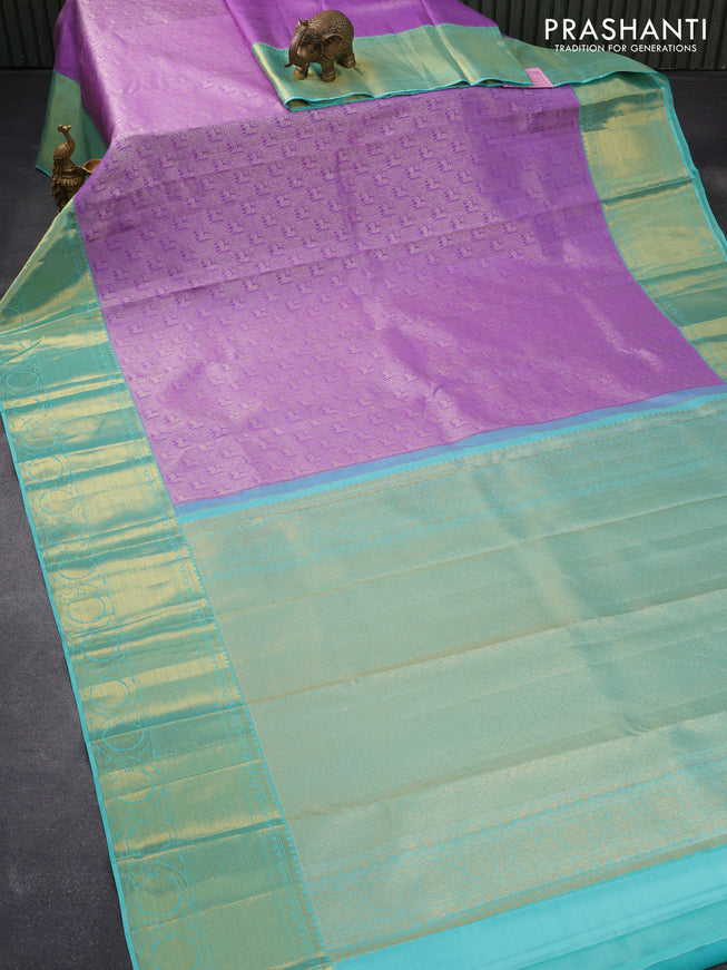 Pure kanjivaram silk saree lavender and teal blue with allover silver zari woven brocade weaves and long rich zari woven border