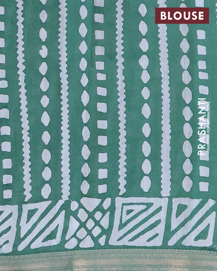 Semi gadwal saree green with allover batik butta prints and zari woven border