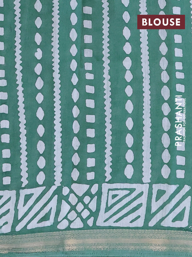 Semi gadwal saree green with allover batik butta prints and zari woven border