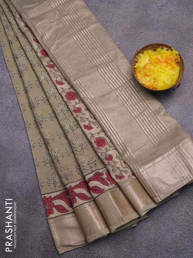 Semi gadwal saree pastel green shade with allover floral butta prints and zari woven border