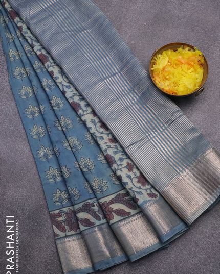 Semi gadwal saree blue shade with allover floral butta prints and zari woven border