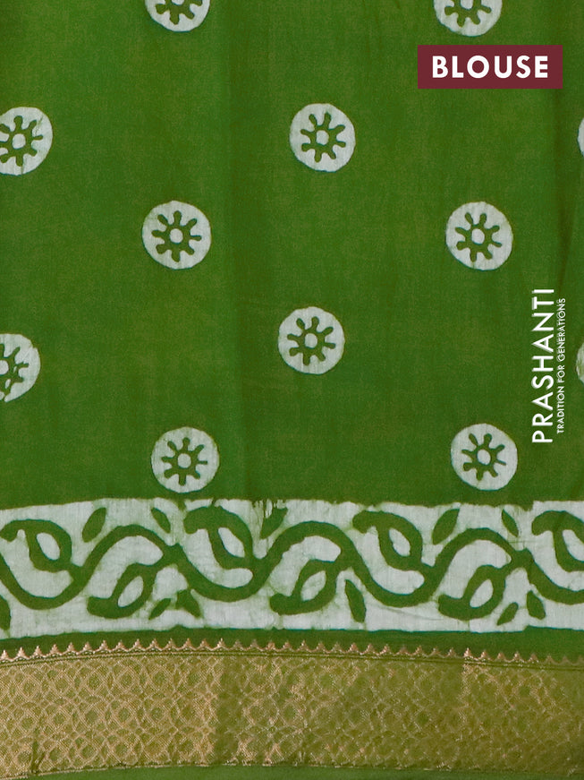 Semi gadwal saree green with allover batik prints and zari woven border