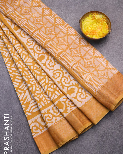 Semi gadwal saree dark mustard and off white with allover batik prints and zari woven border
