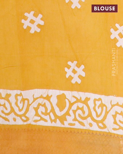 Semi gadwal saree dark mustard and off white with allover batik prints and zari woven border