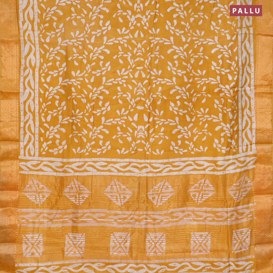 Semi gadwal saree mustard yellow with allover batik prints and zari woven border