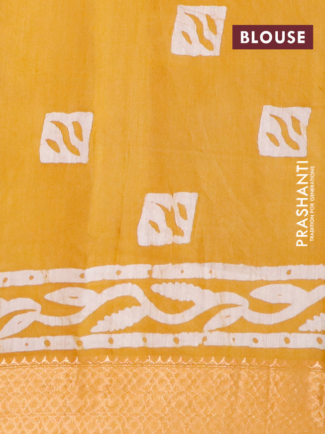 Semi gadwal saree mustard yellow with allover batik prints and zari woven border