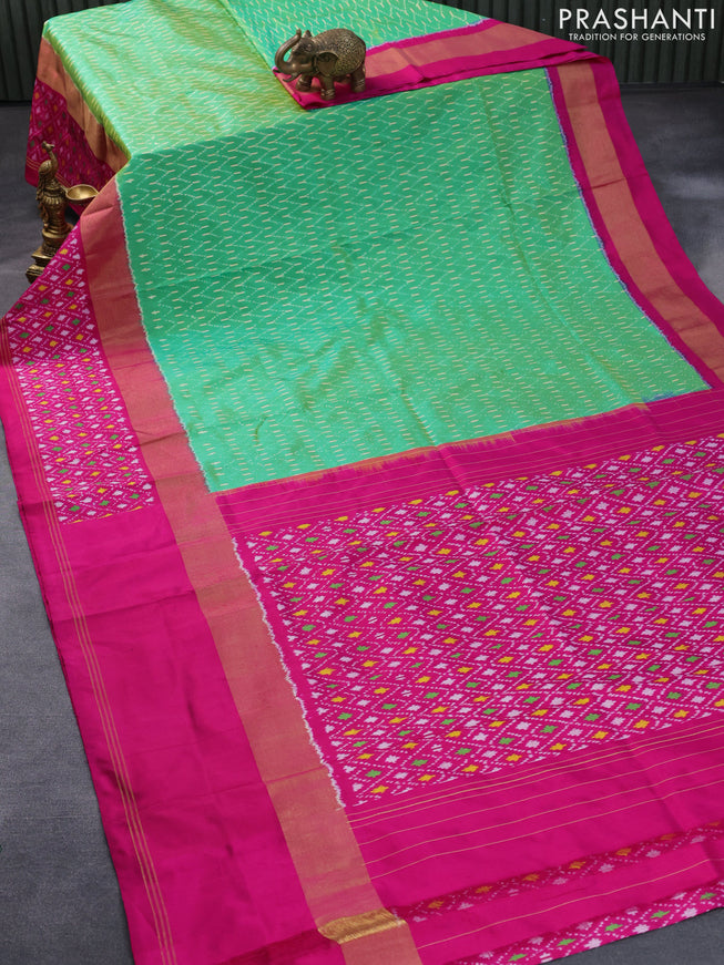 Pochampally silk saree green and pink with allover ikat weaves and zari woven ikat border