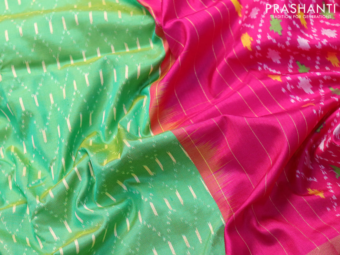 Pochampally silk saree green and pink with allover ikat weaves and zari woven ikat border