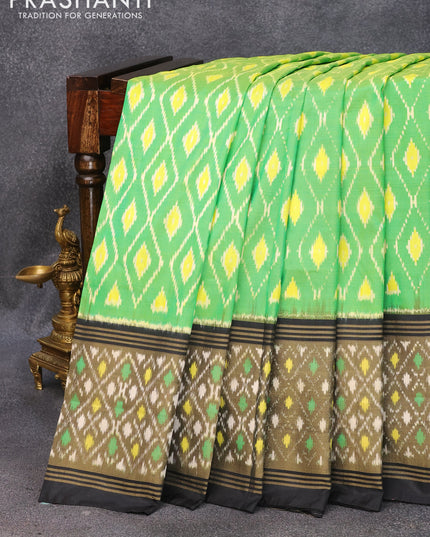 Pochampally silk saree light green and black with allover ikat weaves and long ikat woven border