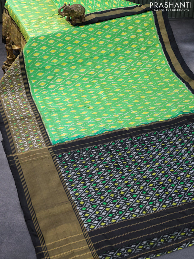 Pochampally silk saree light green and black with allover ikat weaves and long ikat woven border