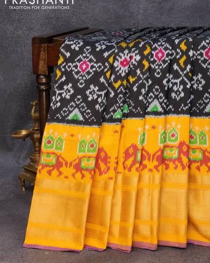 Pochampally silk saree black and mango yellow with allover ikat weaves and long zari woven border