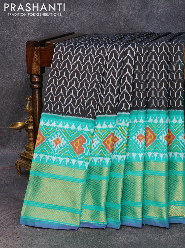 Pochampally silk saree black and teal green with allover ikat weaves and long ikat woven zari border