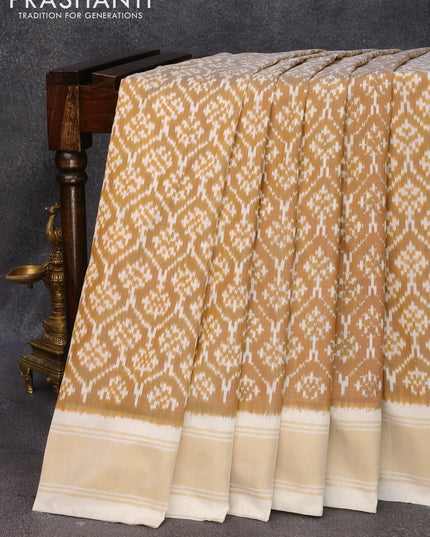 Pochampally silk saree rust shade and cream with allover ikat weaves and zari woven border