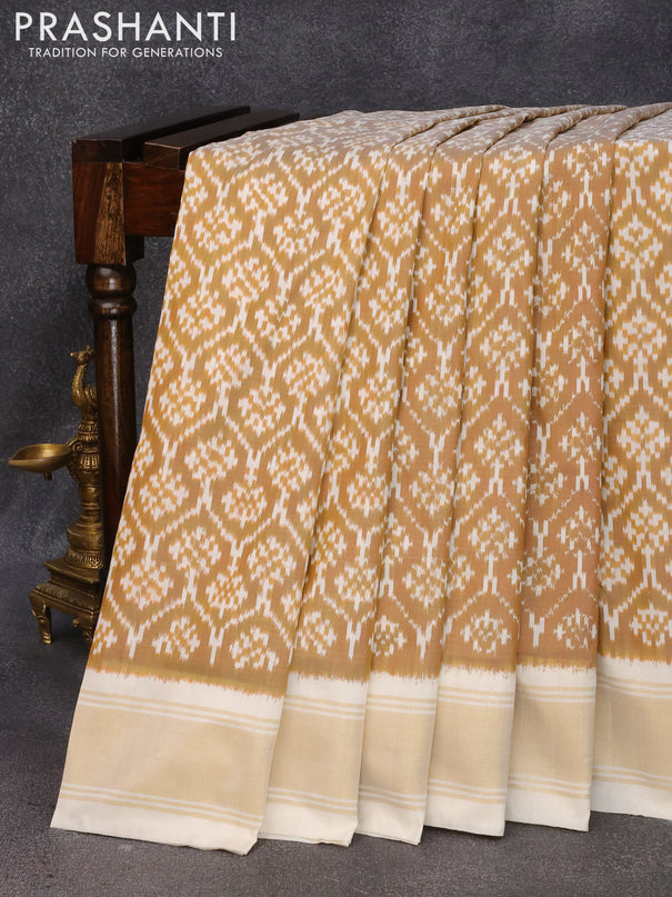 Pochampally silk saree rust shade and cream with allover ikat weaves and zari woven border