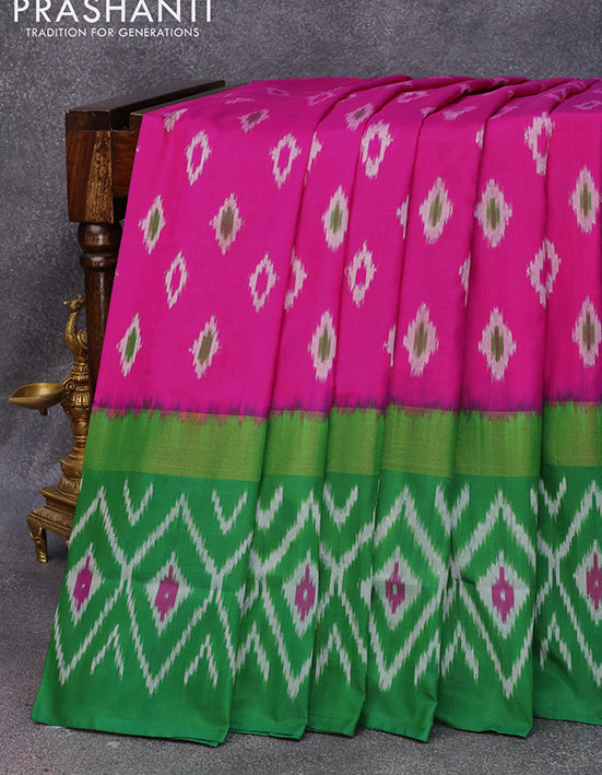 Pochampally silk saree magenta pink and green with allover ikat butta weaves and long zari woven ikat style border