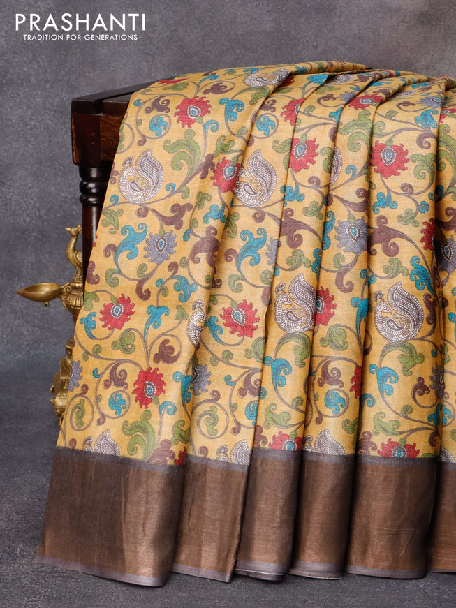 Pure tussar silk saree mustard yellow and greyish brown with allover kalamkari prints and zari woven border