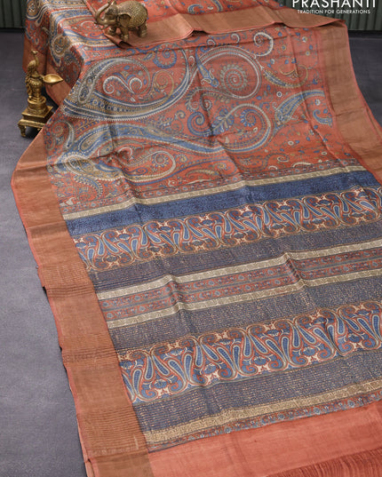 Pure tussar silk saree rust shade with allover paisley prints and zari woven border