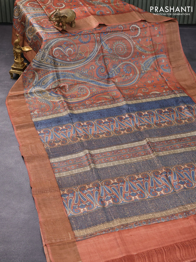 Pure tussar silk saree rust shade with allover paisley prints and zari woven border