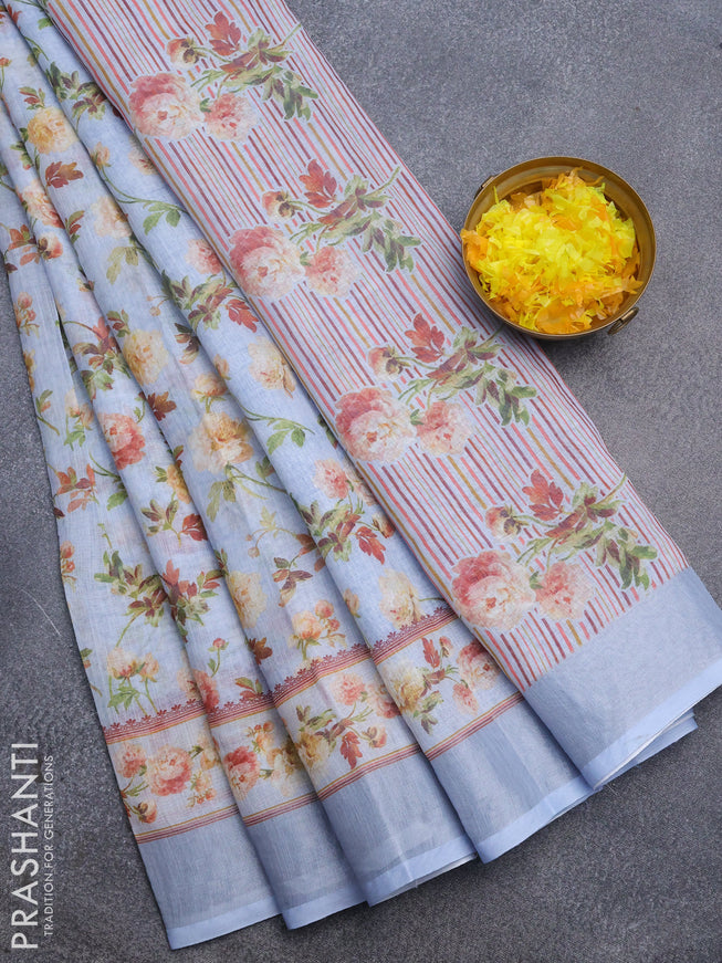 Linen cotton saree greyish blue with allover floral prints and silver zari woven border