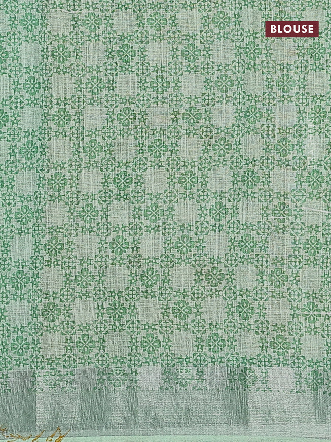 Linen cotton saree teal green with allover floral prints and silver zari woven border