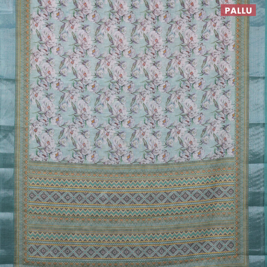 Linen cotton saree teal green shade with allover floral prints and silver zari woven border