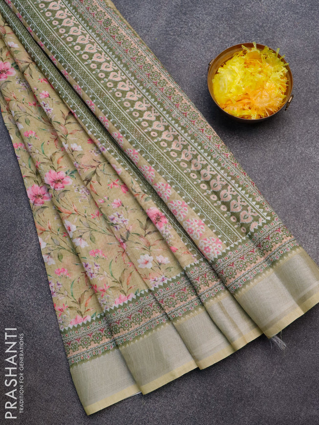 Linen cotton saree elaichi green with allover floral prints and silver zari woven border