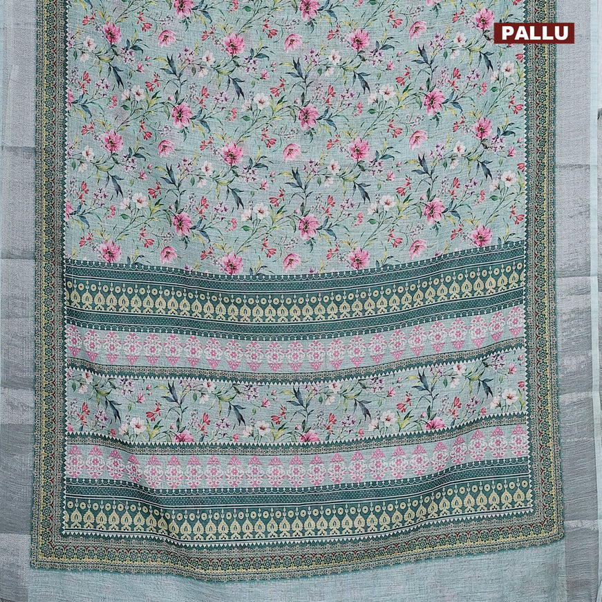 Linen cotton saree teal blue with allover floral prints and silver zari woven border