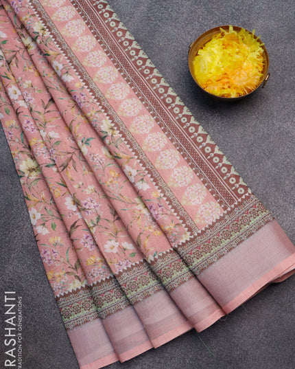 Linen cotton saree pastel pink shade with allover floral prints and silver zari woven border