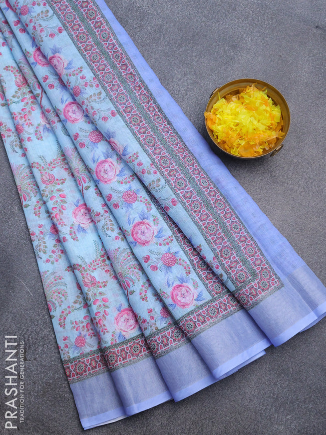 Linen cotton saree light blue and blue shade with allover floral prints and silver zari woven border