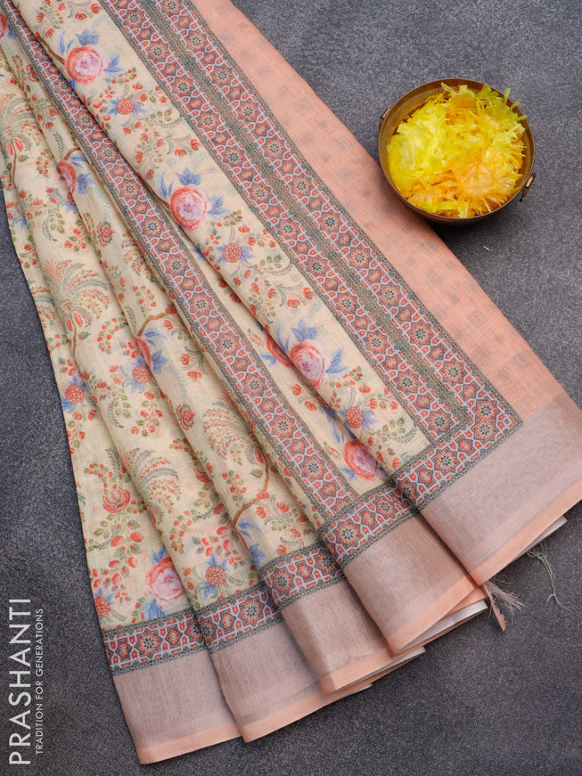 Linen cotton saree pale orange and peach orange with allover floral prints and silver zari woven border