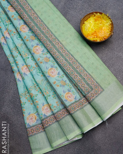 Linen cotton saree teal green and green with allover floral prints and silver zari woven border