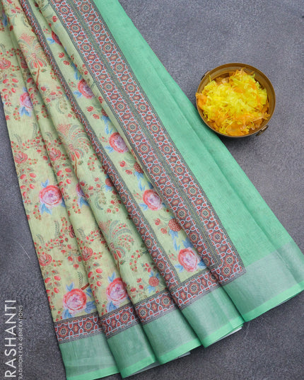 Linen cotton saree pista green and green with allover floral prints and silver zari woven border