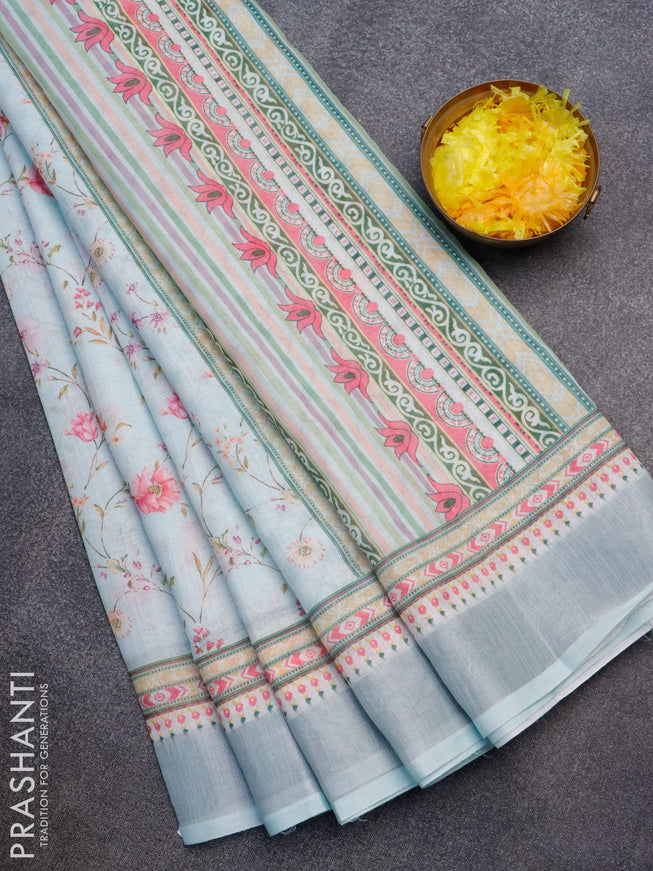 Linen cotton saree light blue with allover floral prints and silver zari woven border