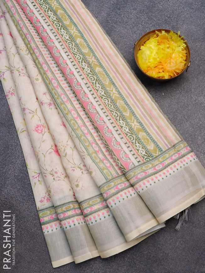 Linen cotton saree cream with allover floral prints and silver zari woven border