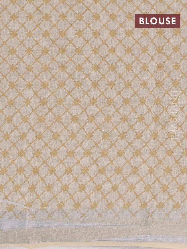 Linen cotton saree cream with allover floral prints and silver zari woven border