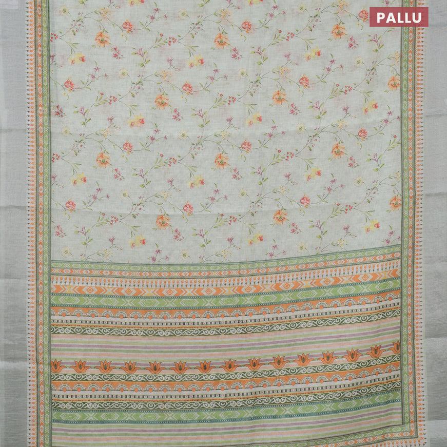 Linen cotton saree green shade with allover floral prints and silver zari woven border