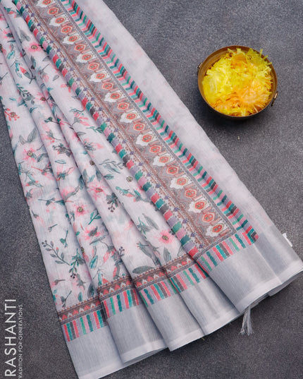 Linen cotton saree off white and pastel grey with allover floral prints and silver zari woven border