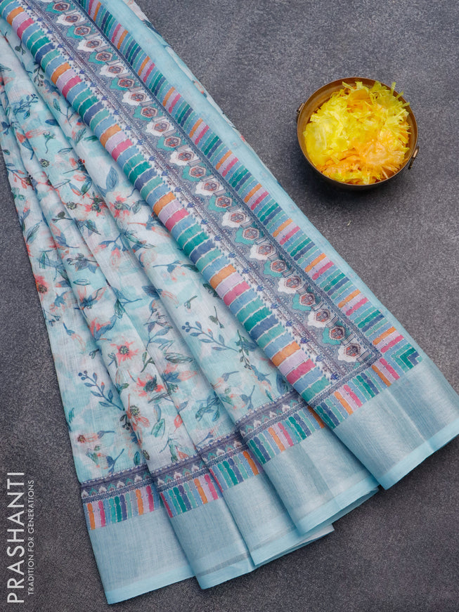 Linen cotton saree off white and teal blue with allover floral prints and silver zari woven border