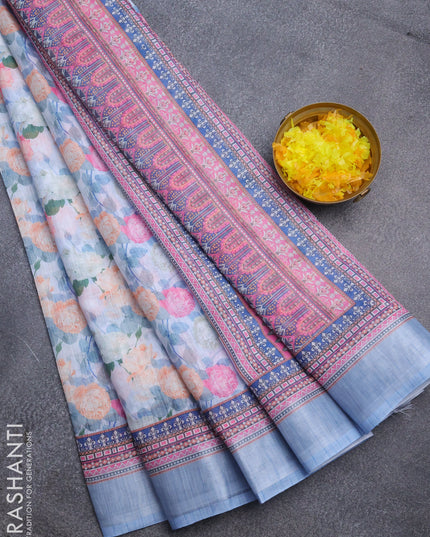 Linen cotton saree pastel blue with allover floral prints and silver zari woven border