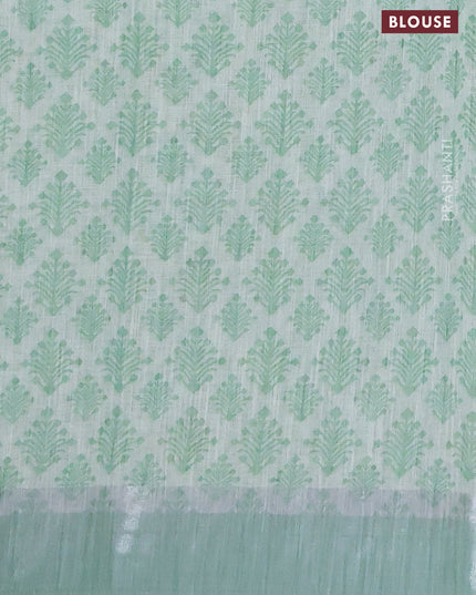 Linen cotton saree pista green with allover floral prints and silver zari woven border