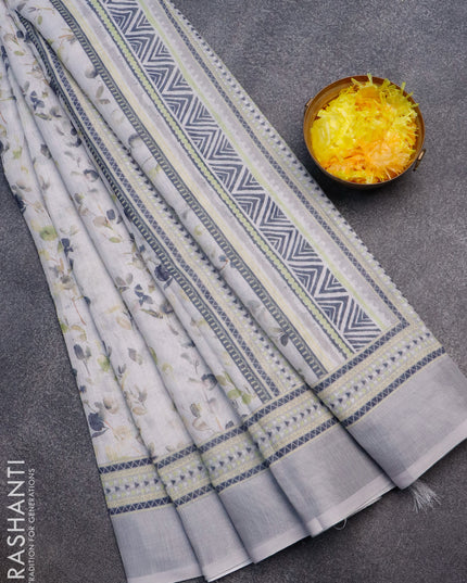 Linen cotton saree off white and grey with allover weaves and silver zari woven border