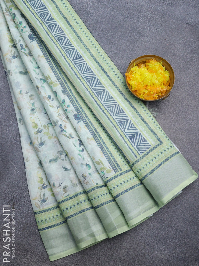 Linen cotton saree pastel green with allover weaves and silver zari woven border