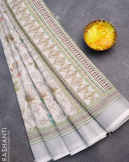 Linen cotton saree off white with allover floral prints and silver zari woven border