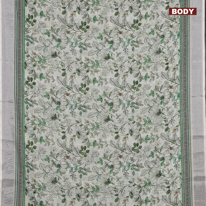 Linen cotton saree off white and green with allover floral prints and silver zari woven border