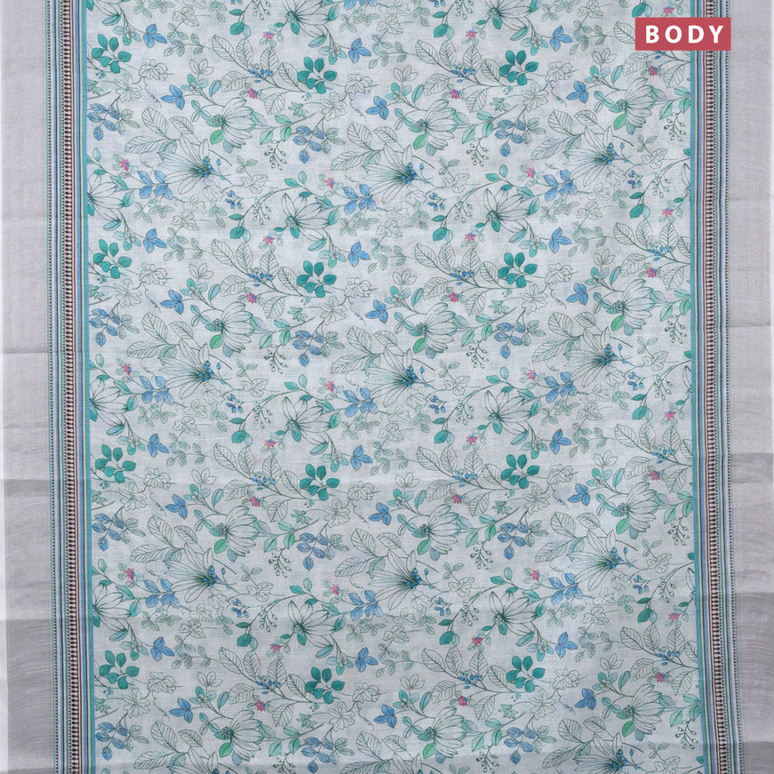 Linen cotton saree off white and blue with allover floral prints and silver zari woven border