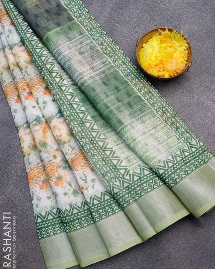 Linen cotton saree off white and green with allover floral prints and silver zari woven border