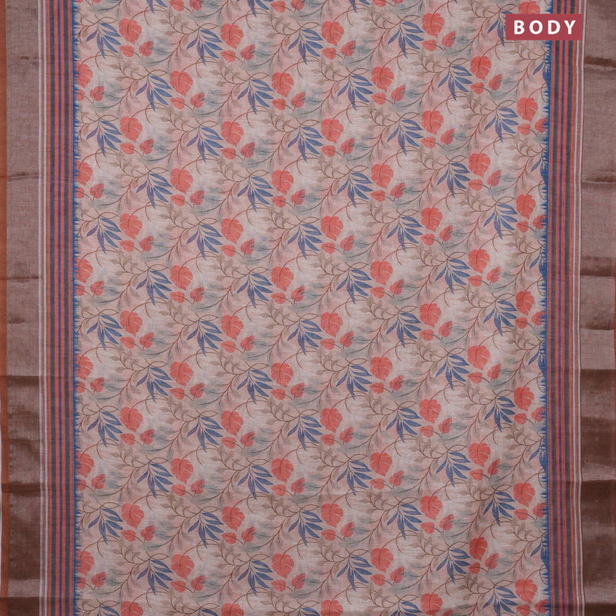 Linen cotton saree pastel peach and brown with allover prints and silver zari woven border