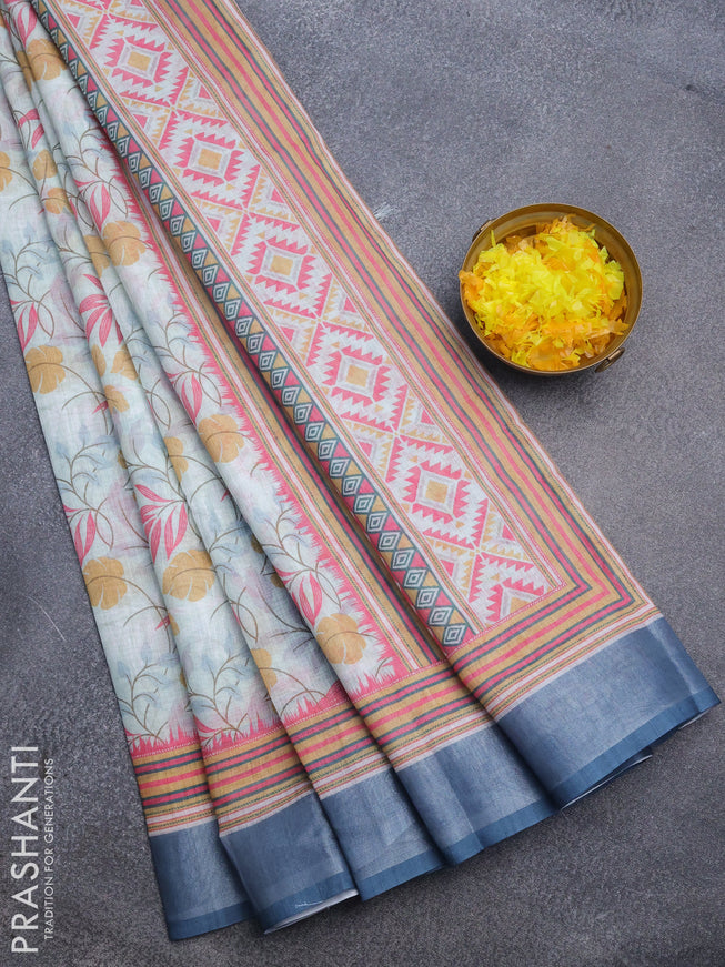 Linen cotton saree teal blue and blue with allover prints and silver zari woven border