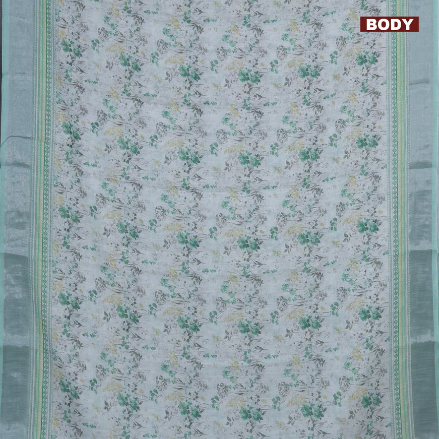 Linen cotton saree off white and green shade with allover floral prints and silver zari woven border